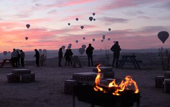 NEVSEHIR, TURKIYE - JANUARY 01: Tourists who welcome the new year in Cappadocia of Turkiye's Nevsehir join the hot air balloon tours and explore the region on January 1, 2024. (Photo by Behcet Alkan/Anadolu via Getty Images)