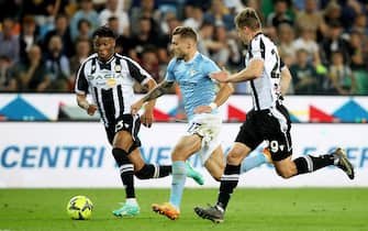 Lazio’s Ciro Immobile (C) contrasted by Udinese’s Jaka Bijol and Destiny Udogie (L) during the Italian Serie A soccer match Udinese Calcio vs SS Lazio at the Friuli - Dacia Arena stadium in Udine, Italy, 21 May 2023. ANSA / GABRIELE MENIS