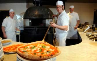 Visit to two new pizza establishments in Boulder on Wednesday, February 2, 2011. Pizzaiolo Jordan Wallace unloadsa a margherita at Pizzaria Locale at 1738 Pearl Street. Cyrus McCrimmon, The Denver Post  (Photo By Cyrus McCrimmon/The Denver Post via Getty Images)