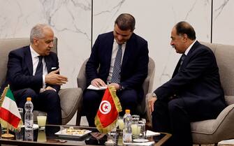 epa10629464 Italian Interior Minister Matteo Piantedosi (L) and Tunisian Interior Minister Kamel Fekih (R)  during their meeting at the airport in Tunis, Tunisia, 15 May 2023. Italian Interior Minister Matteo Piantedosi is on an official visit to Tunisia.This visit comes as Tunisia suffers from the increase in migratory flows.  EPA/MOHAMED MESSARA