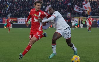 AC Monza's mildfielder Andrea Colpani in action against Genoa CFC's defender Ridgeciano Haps.during the Italian Serie A soccer match between AC Monza and CFC Genoa at U-Power Stadium in Monza, Italy, 10 December 2023. ANSA / ROBERTO BREGANI