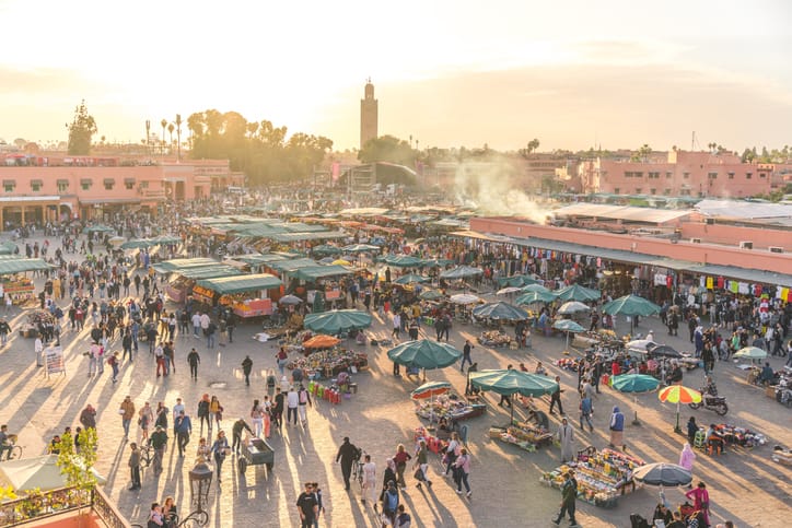 Djemaa el Fna square full of crowd at sunset, Marrakech, Morocco