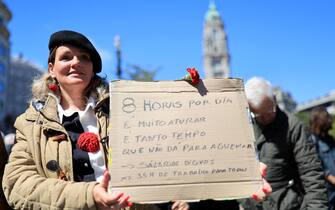 epa11312917 People attend a demonstration to mark International Labor Day in Porto, Portugal, 01 May 2024. Labor Day, or May Day, is observed all over the world on the first day of May to celebrate the economic and social achievements of workers and advocate for their rights.  EPA/ESTELA SILVA