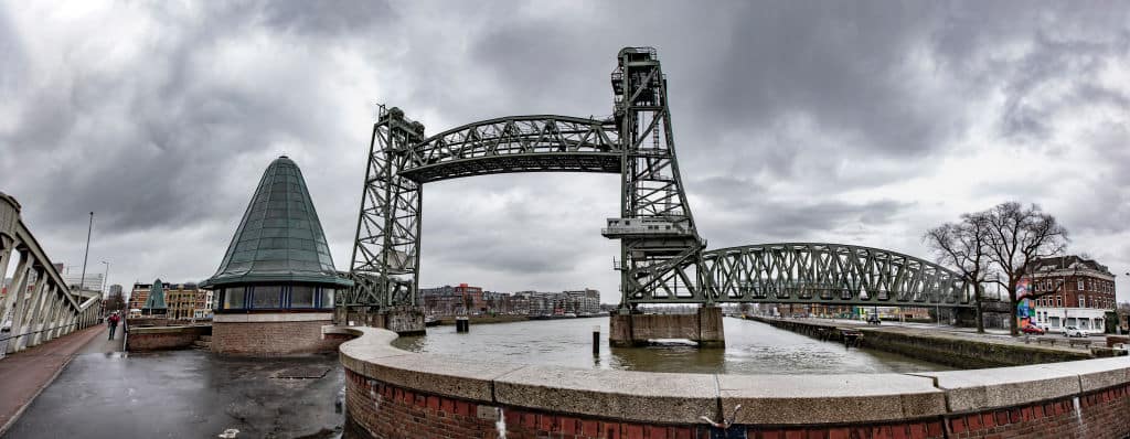 Panoramic wide angle view of the iconic historic De Hef - Koningshavenbrug Bridge in the Dutch port city of Rotterdam may be dismantled for Jeff Bezos superyacht to pass under, as the mast of the sailboat exceeds the height of the bridge. The two-tower with swing lift bridge is an old level steel railroad bridge connecting the island, Noordereiland in the Maas river in the Southern part of Rotterdam. The bridge was built in 1877 and suffered damage during the 1940 German bombings. Since 2017 after the renovation work, the municipality promised that the bridge would never be dismantled again. The superyacht for the multibillionaire chairman of Amazon is built in the Dutch shipyards of Oceanco. The city council said in a statement that if they will proceed the cost of the deconstruction will be covered by the shipbuilder. Rotterdam, The Netherlands on February 4, 2022 (Photo by Nicolas Economou/NurPhoto via Getty Images)