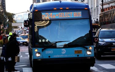 NEW YORK, NY - NOVEMBER 12: An MTA bus stops to pick up passengers on 34th Street in Herald Square on November 12, 2023, in New York City.  (Photo by Gary Hershorn/Getty Images)