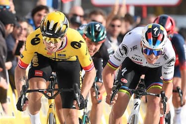 Team Jumbo's Slovenian rider Primoz Roglic (L) crosses the finish line first ahead of Quick-Step Belgian rider Remco Evenepoel during the 1st stage of the 2023 Tour of Catalonia cycling race, a 164,5 km loop starting and finishing in Sant Feliu de Guixols on March 20, 2023. (Photo by Josep LAGO / AFP) (Photo by JOSEP LAGO/AFP via Getty Images)
