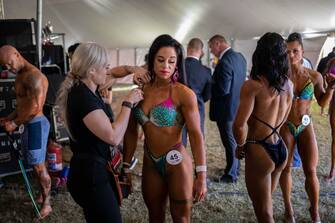 epa10638613 Athletes warm up prior to the Women's Physique section of the Arnold Classic Africa multi-sport festival, held in Johannesburg, South Africa, 19 May 2023. The festival sees athletes competing in 45 different sports and events. Initiated by former Austrian body builder Arnold Schwarzenegger, the sports festival does not only present body building shows but also classes and competitions in categories from Arm-Wrestling to Zumba.  EPA/KIM LUDBROOK
