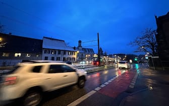 17 January 2024, Baden-Württemberg, Freiburg im Breisgau: Cars drive in the rain in the city. According to the German Weather Service, black ice and severe traffic obstructions are to be expected. Photo: Philipp von Ditfurth/dpa (Photo by Philipp von Ditfurth/picture alliance via Getty Images)