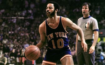 BOSTON - 1973:  Walt Frazier #10 of the New York Knicks moves the ball up court against the Boston Celtics during the Eastern Conference Finals played in 1973 at the Boston Garden in Boston, Massachusetts. NOTE TO USER: User expressly acknowledges and agrees that, by downloading and or using this photograph, User is consenting to the terms and conditions of the Getty Images License Agreement. Mandatory Copyright Notice: Copyright 1973 NBAE (Photo by Dick Raphael/NBAE via Getty Images)