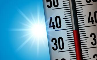 Concept of the heat wave with a thermometer taken in close-up to show the rise in temperatures following global warming.