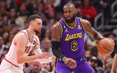 CHICAGO, ILLINOIS - MARCH 29: LeBron James #6 of the Los Angeles Lakers is defended by Zach LaVine #8 of the Chicago Bulls during the first half at United Center on March 29, 2023 in Chicago, Illinois. NOTE TO USER: User expressly acknowledges and agrees that, by downloading and or using this photograph, User is consenting to the terms and conditions of the Getty Images License Agreement. (Photo by Michael Reaves/Getty Images)