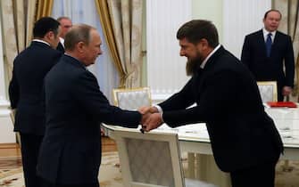MOSCOW, RUSSIA- SEPTEMBER, 23 (RUSSIA OUT) Russian President Vladimir Putin (L) greets Head of Chechnya Ramzan Kadyrov (R) during his meeting with newly elected governors at the Kremlin in Moscow, Russia, on September, 23, 2016. Putin has received new governors who won their elections held last Sunday. (Photo by Mikhail Svetlov/Getty Images)