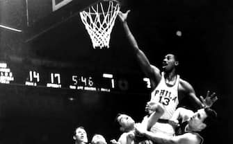 PHILADELPHIA - 1960:  Wilt Chamberlain #13 of the Philadelphia Warriors shoots a layup against the Detroit Pistons during an NBA game circa 1960 played in Philadelphia, Pennsylvania.  NOTE TO USER: User expressly acknowledges that, by downloading and or using this photograph, User is consenting to the terms and conditions of the Getty Images License agreement. Mandatory Copyright Notice: Copyright 1960 NBAE (Photo by NBA Photo Library/NBAE via Getty Images)