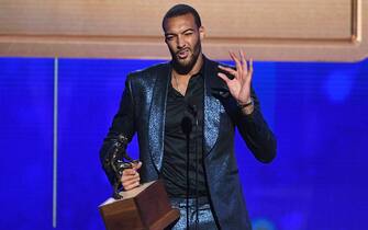 SANTA MONICA, CALIFORNIA - JUNE 24: Rudy Gobert accepts the Kia NBA Defensive Player of the Year award onstage during the 2019 NBA Awards presented by Kia on TNT at Barker Hangar on June 24, 2019 in Santa Monica, California. (Photo by Kevin Winter/Getty Images for Turner Sports)