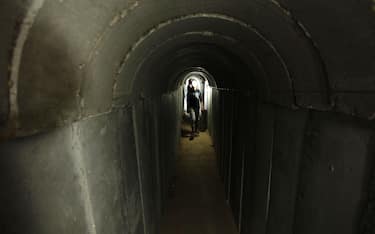 Palestinians walk inside a tunnel used for military exercises during a weapon exhibition at a Hamas-run youth summer camp, in Gaza City, on July 21, 2016. Photo by Ashraf Amra//APAIMAGES_092756/Credit:APA IMAGES/SIPA/1607220945