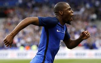 epa06026820 Djibril Sidibe of France celebrates after scoring during the friendly soccer match between France and England at the Stade de France in Paris, France, 13 June 2017.  EPA/ETIENNE LAURENT