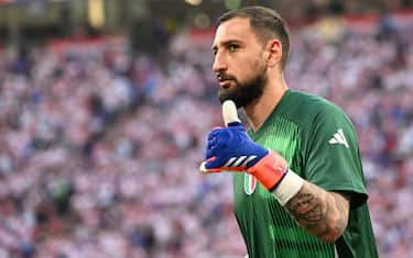 Italyâ  s goalkeeper Gianluigi Donnarumma gestures to Italy's supporters during the warm-up ahead of the UEFA EURO 2024 Group B soccer match between Italy and Croatia in Leipzig, Germany, 24 June 2024. ANSA/DANIEL DAL ZENNARO
