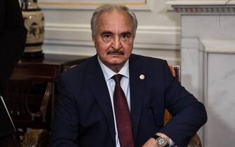 Libyan strongman Khalifa Haftar sits during talks with Greek Foreign Minister in Athens, on January 17, 2020, days ahead of a peace conference in Berlin which he and the head of Tripoli's UN-recognised government are expected to attend. - The talks come as world powers step up efforts for a lasting ceasefire, nine months since an assault on Tripoli by Haftar's forces sparked fighting that has killed more than 280 civilians and 2,000 fighters, displacing tens of thousands. (Photo by ARIS MESSINIS / AFP) (Photo by ARIS MESSINIS/AFP via Getty Images)