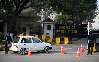 A Pakistani police officer checks a vehicle stand entering the Ministry of Foreign Affairs in Islamabad on January 18, 2024. Pakistan said on January 18 it had carried out strikes against militant targets in Iran, after Tehran launched attacks on Pakistani territory earlier this week. (Photo by Aamir QURESHI / AFP)