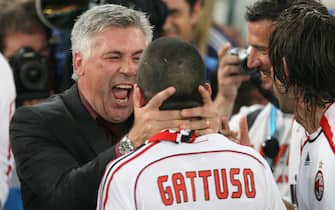 AC Milan coach Carlo Ancelotti (L) congratulates player Gennaro Gattuso after the Italian Serie A giant won the UEFA Champions League final at the Olympic stadium in Athens, Greece, 23 May 2007. 
ANSA/KERIM OKTEN