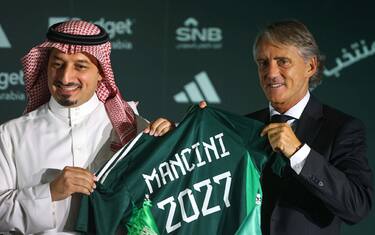 The president of the Saudi Arabian Football Federation, Yasser al-Misehal (L) and newly appointed Italian coach of the Saudi national football team, Roberto Mancini, pose for a picture at a press conference and signing ceremony in Riyadh, on August 28, 2023. Mancini was yesterday named as the new coach of the Saudi Arabia national team on a deal reported to be worth more than $25 million a year after he controversially quit the Italy job earlier this month. (Photo by Fayez NURELDINE / AFP)