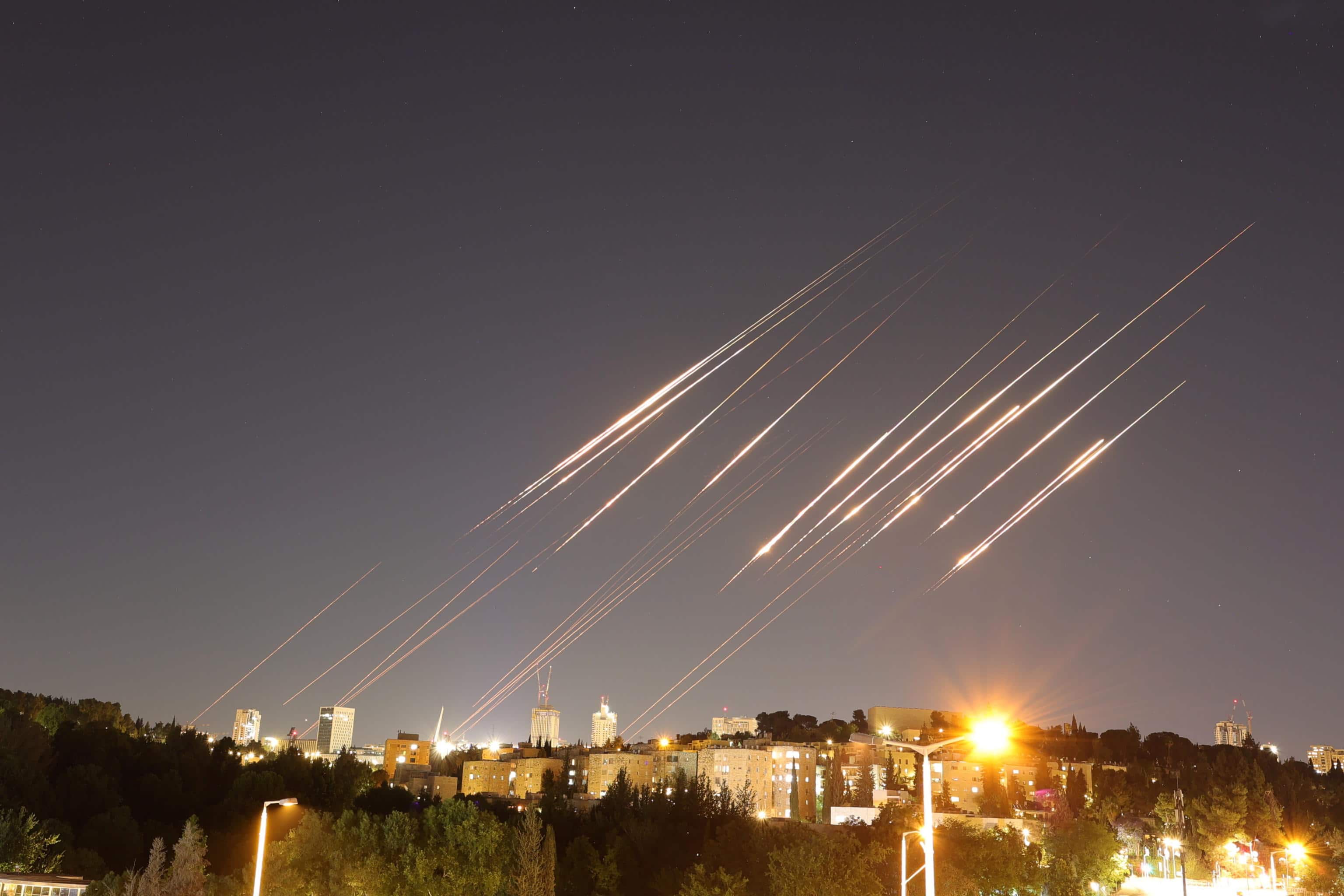 MIDEAST ISRAEL PALESTINIANS IRAN CONFLICT epa12175801 A slow exposure picture shows ballistic missiles above Jerusalem, 14 June 2025. Israel's military has identified missiles being launched from Iran towards the territory of Israel in retaliation following overnight airstrikes on Iranian targets. EPA/ABIR SULTAN