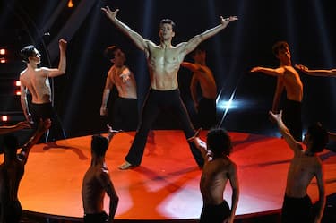 Italian ballet dancer Roberto Bolle (C) performs with Lausanne Bejant Ballet on stage at the Ariston theatre during the 74th Sanremo Italian Song Festival, Sanremo, Italy, 10 February 2024. The music festival will run from 06 to 10 February 2024.  ANSA/ETTORE FERRARI
