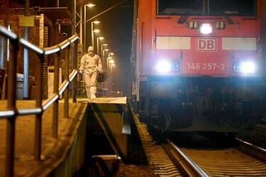 25 January 2023, Schleswig-Holstein, Brokstedt: Forensics staff are on duty on a platform near the regional train at Brokstedt station.  Two people were killed and several injured in a knife attack on a regional train from Kiel to Hamburg. According to the Federal Police, the crime occurred shortly before 3 p.m. before the arrival of the train at Brokstedt station in the district of Steinburg. Photo: Jonas Walzberg/dpa (Photo by Jonas Walzberg/picture alliance via Getty Images)