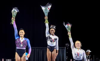 epa10786959 First place Simone Biles (C) reacts with second place Leanne Wong (L) and third place Joscelyn Roberson (R) celebrate during the awards ceremony after the Core Hydration Classic at the NOW Arena in Hoffman Estates, Illinois, USA, 05 August 2023. Biles returned to competition after a two-year break after the Tokyo Olympics.  EPA/ALEX WROBLEWSKI