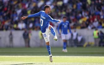 Italy's forward #10 Lorenzo Pellegrini scores his team's first goal during the international friendly football match between Italy and Ecuador at Red Bull Arena in Harrison, New Jersey, on March 24, 2024. (Photo by Charly TRIBALLEAU / AFP)