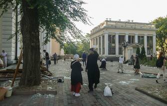 epa10763443 People clean debris near the Transfiguration Cathedral damaged by a missile attack in the Odesa region, southern Ukraine, 23 July 2023. Odesa was attacked by 19 missiles of different classes early 23 July, with nine being shot down, according to a statement from the Ukraine Air Force. At least one person was killed in the attack and 22 were injured, including four children, the State Emergency Service reported. Russia, which began its full-scale invasion of Ukraine in February 2022, has recently pulled out of a UN-Turkey brokered agreement guaranteeing safe passage to Ukrainian grain exports through the Black Sea and started the mass shelling of Odesa city, granaries, agricultural enterprises and sea ports.  EPA/IGOR TKACHENKO