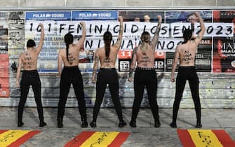 epa11107853 Members of the feminist activist group 'Femen' show the motto in Spanish 'ni una menos' (lit. Not one 'woman' less) on their nude backs as they protest to denounce violence against women, in downtown Madrid, Spain, 27 January 2024.  EPA/VICTOR LERENA