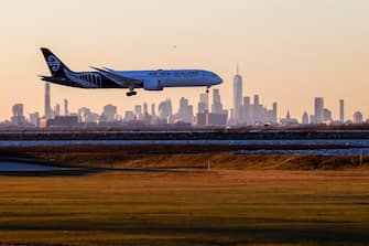 A Boeing 787-9 Dreamliner passenger aircraft of Air New Zealand arrives from Auckland at JFK International Airport in New York as the Manhattan skyline looms in the background on February 5, 2024. (Photo by Charly TRIBALLEAU / AFP) (Photo by CHARLY TRIBALLEAU/AFP via Getty Images)
