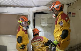 HUALIEN, TAIWAN - APRIL 3: (----EDITORIAL USE ONLY  MANDATORY CREDIT - 'HUALIEN COUNTY FIRE DEPARTMENT / HANDOUT' - NO MARKETING NO ADVERTISING CAMPAIGNS - DISTRIBUTED AS A SERVICE TO CLIENTS----) Fire fighters search inside a building for rescue operation as at least four people were killed and hundreds of others injured after a magnitude 7.4 earthquake struck off Taiwan's eastern coast on the Richter scale, in Hualien, Taiwan on April 3, 2024. The Uranus Building tilted at an angle of more than 60 degrees, and one person is still missing. (Photo by Hualien County Fire Department/Anadolu via Getty Images)