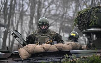 MARIENBERG, GERMANY - JANUARY 12: A soldier of Bundeswehr's Panzergrenadierbrigade 37 mechanized infantry unit is seen with a camouflaged Marder infantry fighting vehicle to be sent to Ukraine as German Minister of Defense Christine Lambrecht (not seen) visits NATO Response Force (NRF), in Marienberg, Germany on January 12, 2023. (Photo by Abdulhamid Hosbas/Anadolu Agency via Getty Images)