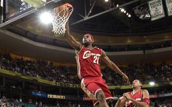 BOSTON - FEBRUARY 15:  LeBron James #23 of the Cleveland Cavaliers dunks over Delonte West #13 of the Boston Celtics February 15, 2006 at the TD Banknorth Garden in Boston, Massachusetts.  NOTE TO USER: User expressly acknowledges and agrees that, by downloading and/or using this Photograph, user is consenting to the terms and conditions of the Getty Images License Agreement. Mandatory Copyright Notice: Copyright 2006 NBAE (Photo by Brian Babineau/NBAE via Getty Images)