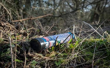 A Fast Gas nitrous oxide cylinder lies on the ground in an Epping Forest layby, on 5th February 2023, in London, England. Fast Gas state that their nitrous oxide disposable cylinders have a capacity of 640 grams of nitrous oxide with a purity level of 99%. Nitrous oxide is illegal under the 2016 Psychoactive Substances Act but laughing gas is now the fourth most used drug in the UK, according to the Global Drug Survey 2015. (Photo by Richard Baker / In Pictures via Getty Images)