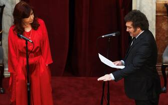Argentina's new President Javier Milei (R) takes oath next to Argentine outgoing Vice-President Cristina Fernandez de Kirchner (L) during his inauguration ceremony at the Congress, in Buenos Aires on December 10, 2023. Javier Milei will be sworn in as Argentina's president , as the country steels itself for harsh spending cuts and economic reforms aimed at curbing rampant inflation.  (Photo by ALEJANDRO PAGNI / AFP)