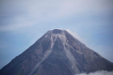 epa10683010 The summit of the Mayon Volcano is seen from Legaspi city, Albay province, Philippines, 10 June 2023. The province of Albay was placed under a state of calamity due to the threat of an eruption of Mayon Volcano. Mayon is considered to be the Philippines most active volcano with a record of 50 eruptions in the last 500 years.  EPA/FRANCIS R. MALASIG