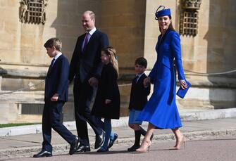 epa10565982 Britain's Prince William, Prince of Wales and Catherine, Princess of Wales with their children, Prince George (L), Princess Charlotte (C) and Prince Louis (R) arrive for the Easter Sunday service at St Georges Chapel at Windsor Castle in Windsor, Britain, 09 April 2023.  EPA/NEIL HALL