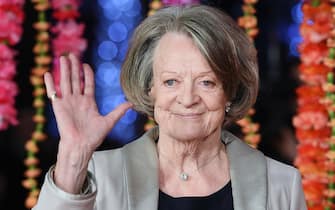 Maggie Smith epa11628425 (FILE) - British actor Dame Maggie Smith arrives for the premiere of 'The Second Best Exotic Marigold Hotel' in London, Britain, 17 February 2015 (reissued 27 September 2024). Dame Maggie Smith died at the age of 89, according to her family. The actor was best known for her role in the Harry Potter films and the TV series Downton Abbey. EPA/ANDY RAIN *** Local Caption *** 51803760