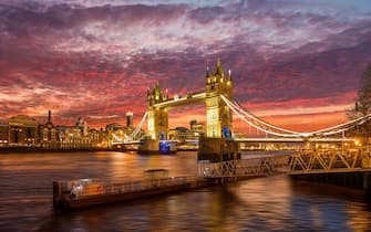 Tower Bridge illuminated at dusk, London, England