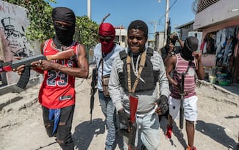 Jimmy "Barbecue" Chérizier (center) is a Haitian gang leader and a former police officer who is the head of the G9 gang federation which consists of over a dozen Haitian gangs based in Port au Prince. Chérizier is currently considered the most powerful gang leader in Haiti today.