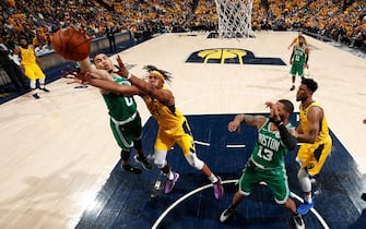 INDIANAPOLIS, IN - APRIL 21: Jayson Tatum #0 of the Boston Celtics battles for possession of the ball during the game against Myles Turner #33 of the Indiana Pacers during Game Four of Round One of the 2019 NBA Playoffs on April 21, 2019 at Bankers Life Fieldhouse in Indianapolis, Indiana. NOTE TO USER: User expressly acknowledges and agrees that, by downloading and or using this photograph, User is consenting to the terms and conditions of the Getty Images License Agreement. Mandatory Copyright Notice: Copyright 2019 NBAE (Photo by Jeff Haynes/NBAE via Getty Images)