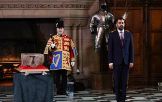 ATTENTION EDITORS - PICTURE EMBARGOED TO 0600 GMT FRIDAY APRIL 28, 2023  Scotland's First Minister Humza Yousaf stands beside the Stone of Destiny in Edinburgh Castle before onward transportation to Westminster Abbey for the Coronation of King Charles III, in Edinburgh, Scotland, Britain April 27, 2023. REUTERS/Russell Cheyne/Pool