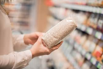 Unrecognizable buying organic rice in store