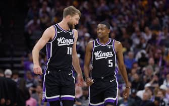 SACRAMENTO, CALIFORNIA - OCTOBER 29: Domantas Sabonis #10 of the Sacramento Kings talks to teammate De'Aaron Fox #5 during the game against the Los Angeles Lakers at Golden 1 Center on October 29, 2023 in Sacramento, California. NOTE TO USER: User expressly acknowledges and agrees that, by downloading and or using this photograph, User is consenting to the terms and conditions of the Getty Images License Agreement. (Photo by Lachlan Cunningham/Getty Images)