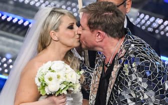 English band Duran Duran lead singer Simon Le Bon kisses Italian actor Katia Follesa on stage at the Ariston theatre during the 75th edition of the Sanremo Italian Song Festival, in Sanremo, Italy, 13 February 2025. The music festival will run from 11 to 15 February 2025. ANSA/ETTORE FERRARI