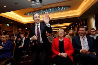 epa11241440 Irish Further and Higher Education Minister Simon Harris waves as he is declared the new leader of Fine Gael at the Sheraton Hotel in Athlone, Ireland, 24 March 2024. Following a shortened leadership contest, Simon Harris became the new de facto leader of the Fine Gael party, paving the way for him to become Ireland's youngest Prime Minister (Taoiseach) after Leo Varadkar resigned.  EPA/DAMIEN EAGERS