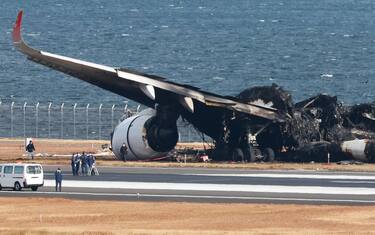 epa11056087 Investigators inspect the crashed Japan Airlines passenger plane at Haneda Airport in Tokyo, Japan, 04 January 2024, after the plane collided with a Japan Coast Guard aircraft on the tarmac on 02 January 2024. The passenger plane carrying 367 passengers and 12 crew crashed with a Japan Coast Guard plane that was transporting relief supplies for victims of an earthquake that occured on 01 January. All passengers and crew on board the passenger plane evacuated safely. Tokyo Metropolitan Police confirmed five of the six crew on board the Japan Coast Guard plane were killed in the collision. Japan Airlines announced on 03 January 2023 that the JAL aircraft recognized the controller's permission to land, read it back, and performed the landing operation. It appears that the Japan Coast Guard plane was already on the runway when the JAL aircraft attempted to land, and the Japan Transport Safety Board and the Metropolitan Police Department are investigating the interaction between the controller and the two planes in detail to determine the cause.  EPA/JIJI PRESS JAPAN OUT EDITORIAL USE ONLY/